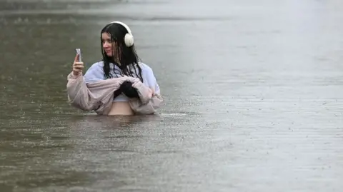 1e55a940-0fab-11f0-9f4f-1b858dcfe51a 1e55a940-0fab-11f0-9f4f-1b858dcfe51a Getty Images A woman stands waist deep in a flood in a suburb of Brisbane in March who should you trust for a weather forecast? Who should you trust for a weather forecast? 1e55a940 0fab 11f0 9f4f 1b858dcfe51a