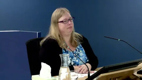 472652f0-84ac-11ef-83dd-fbf1b9732cf0 472652f0-84ac-11ef-83dd-fbf1b9732cf0 Covid Inquiry Photograph of Tamsin Mullen giving evidence in the inquiry room we were not treated as parents, covid inquiry told We were not treated as parents, Covid inquiry told 472652f0 84ac 11ef 83dd fbf1b9732cf0