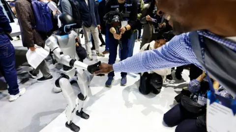 4e1d5510-145b-11f0-8573-69b9cd9dec26 4e1d5510-145b-11f0-8573-69b9cd9dec26 Getty Images Unitree's G1 robot shakes the hand of an attendee at the Mobile World Congress 2025 in Barcelona, Spain, on 5 March, 2025. who will win the race to develop a humanoid robot? Who will win the race to develop a humanoid robot? 4e1d5510 145b 11f0 8573 69b9cd9dec26