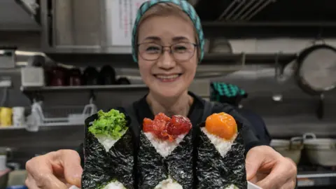6edc9210-3063-11f0-9162-71a9661a21c4 6edc9210-3063-11f0-9162-71a9661a21c4 Getty Images Owner of Onigiri Bongo, a shop specialising in rice balls known as "onigiri" How a joke about rice cost a Japan cabinet minister his job 6edc9210 3063 11f0 9162 71a9661a21c4