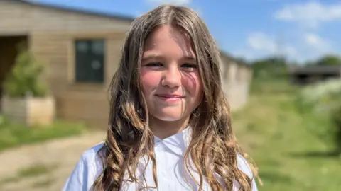 88a5a810-30bf-11f0-8947-7d6241f9fce9 88a5a810-30bf-11f0-8947-7d6241f9fce9 Nancy, aged nine, smiling wearing a white school polo shirt with shoulder length, light brown hair. She is outside and while the background is blurred, she appears to be standing in front of stables. Horse charity calls on NHS to fund equine services Horse charity calls on NHS to fund equine services 88a5a810 30bf 11f0 8947 7d6241f9fce9