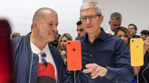 d1dc5290-36f5-11f0-95f6-0d1e4117fa47 d1dc5290-36f5-11f0-95f6-0d1e4117fa47 Getty Images Tim Cook, the CEO of Apple, and Jony Ive view an iPhone during an event in 2018. 'world's greatest designer' jony ive joins openai to 'reimagine' computers 'World's greatest designer' Jony Ive joins OpenAI to 'reimagine' computers d1dc5290 36f5 11f0 95f6 0d1e4117fa47