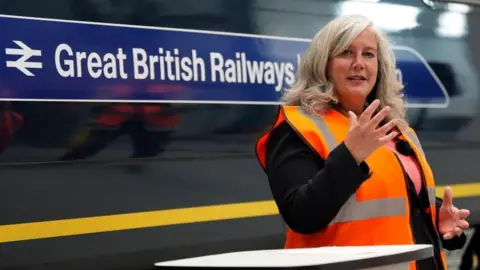 e1391120-38f2-11f0-8e24-c95314850612 e1391120-38f2-11f0-8e24-c95314850612 PA Transport Secretary Heidi Alexander in front of a train carriage with Great British Railways branding, during a visit to the South Western Railway Bournemouth Traincare Depot in Dorset Renationalised railways not on track for cheaper fares e1391120 38f2 11f0 8e24 c95314850612