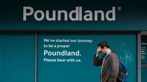 3803e530-4b58-11f0-8bdb-73c0815c1d31 3803e530-4b58-11f0-8bdb-73c0815c1d31 Getty Images A man with his hand to his forehead passes down the signage of a temporarily closed branch of Poundland in Southport, UK, 2024. More than 1,000 jobs at risk as Poundland plans 68 store closures 3803e530 4b58 11f0 8bdb 73c0815c1d31