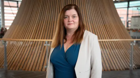 5b2ffe10-45e3-11f0-975b-11a7cfcf1ff6 5b2ffe10-45e3-11f0-975b-11a7cfcf1ff6 Sioned Williams, who has brown, straight hair, looks directly into the camera wearing a cream jacket and blue wrap dress. Wales is UK worst for surgical abortions, says charity 5b2ffe10 45e3 11f0 975b 11a7cfcf1ff6