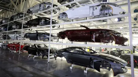 671c03f0-5325-11f0-84fa-777e140dbfd4 671c03f0-5325-11f0-84fa-777e140dbfd4 Reuters Car bodies are stored on shelves at the Aston Martin factory in Gaydon, Britain UK car output hit 76-year low in May as US tariffs hit exports 671c03f0 5325 11f0 84fa 777e140dbfd4