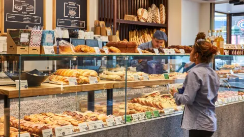 b7aea030-45b4-11f0-a32b-edd3a7eb5f9e b7aea030-45b4-11f0-a32b-edd3a7eb5f9e Paris Baguette Customer looking at bread inside a Paris Baguette outlet in France. The Korean bakery chain that says croissants don't have to be French b7aea030 45b4 11f0 a32b edd3a7eb5f9e