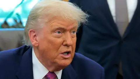 d5a709f0-46be-11f0-98c9-f388968ae068 d5a709f0-46be-11f0-98c9-f388968ae068 Getty Images US President Donald Trump in the Oval Office at the White House Trump claims rare earths deal 'done' with China d5a709f0 46be 11f0 98c9 f388968ae068
