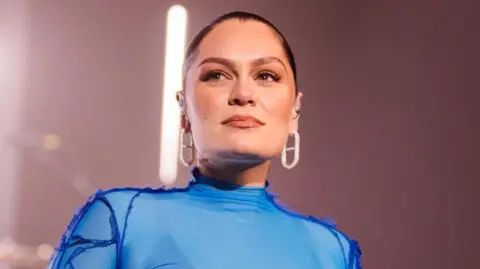 1df3e360-5b1c-11f0-a7cb-992f82c2d299 1df3e360-5b1c-11f0-a7cb-992f82c2d299 Getty Images Jessie J wearing a blue lycra stage costume and large diamond earrings, smiling slightly on stage Jessie J reveals cancer operation success 1df3e360 5b1c 11f0 a7cb 992f82c2d299