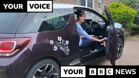 207a6ce0-575b-11f0-960d-e9f1088a89fe 207a6ce0-575b-11f0-960d-e9f1088a89fe BBC Lisa Shackleton sits in the driving seat of her purple Citroen DS3 car with the door open, looking back at the camera, the car is parked on a driveway with bushes in the background, and the words 'your voice, your BBC News' overlaid as a black and white graphic on the image. Citroen owners left stranded over airbag safety risk 207a6ce0 575b 11f0 960d e9f1088a89fe