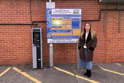 5f3f6330-d8b3-11ef-89b6-372b2b3acad8 5f3f6330-d8b3-11ef-89b6-372b2b3acad8 BBC Rosey Hudson standing by a car park paying machine in Copeland Street, Derby Government code aims to stop unfair parking charges 5f3f6330 d8b3 11ef 89b6 372b2b3acad8