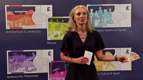 8cab11f0-5696-11f0-960d-e9f1088a89fe 8cab11f0-5696-11f0-960d-e9f1088a89fe BBC Bank of England chief cashier Victoria Cleland holds banknotes and stands in front of mock-ups of new themed notes. Bank of England to redesign banknotes – and wants your help 8cab11f0 5696 11f0 960d e9f1088a89fe