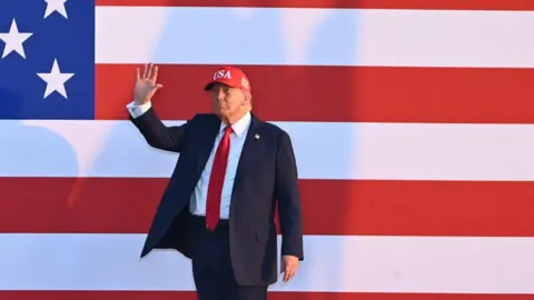 8dafe550-58e7-11f0-a39f-9d9949480f95 8dafe550-58e7-11f0-a39f-9d9949480f95 Getty Images Donald Trump waves wearing a baseball cap and suit in front of a huge US flag poster US debt is now $37trn – should we be worried? 8dafe550 58e7 11f0 a39f 9d9949480f95