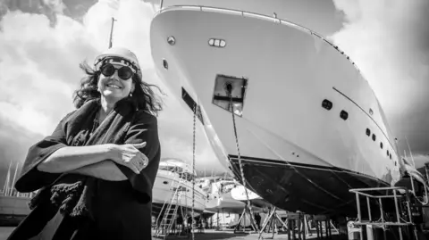 a2a0ac00-51b3-11f0-bdc1-3392cff01039 a2a0ac00-51b3-11f0-bdc1-3392cff01039 Barbara Armerio Italian shipbuilder Barbara Armerio smiles at the camera while crossing her arms, in front of a superyacht being built Why the world's superyachts are getting bigger and bigger a2a0ac00 51b3 11f0 bdc1 3392cff01039