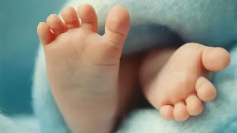 a49702b0-5e75-11f0-a633-790fe0633fd6 a49702b0-5e75-11f0-a633-790fe0633fd6 Getty Images Close up of baby's feet on a blue blanket Babies made using three people's DNA are born free of hereditary disease a49702b0 5e75 11f0 a633 790fe0633fd6