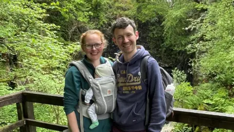 ad156df0-58d0-11f0-a113-db0360eed65c ad156df0-58d0-11f0-a113-db0360eed65c Lucy Slavin Lucy and Daniel Slavin stand with woodland seen behind them. Lucy is carrying their young baby in a baby carrier on her chest. Excellent or awful – why Lifetime ISAs divide opinion ad156df0 58d0 11f0 a113 db0360eed65c
